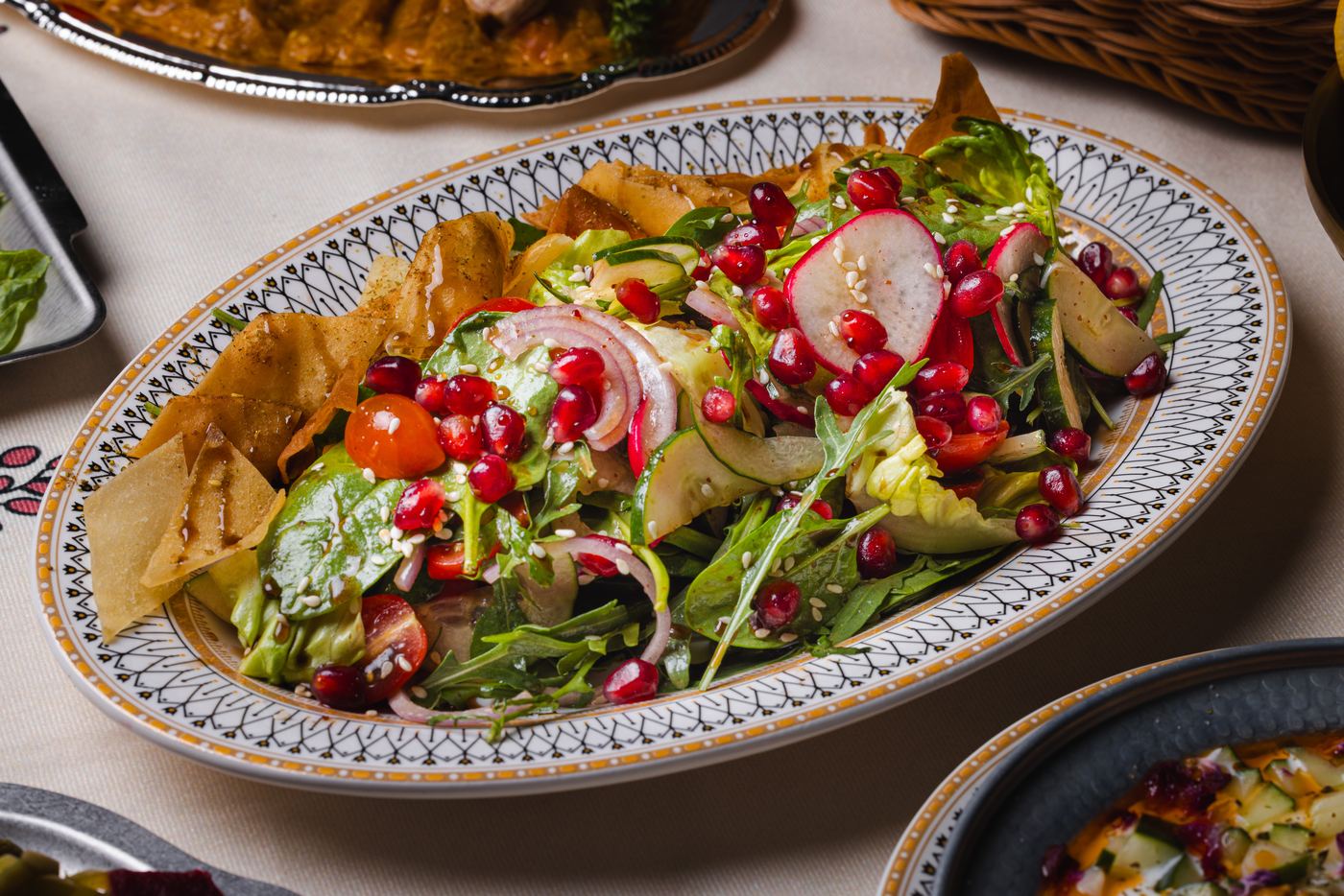 Fattoush at Shirazi: mixed greens, radish, pomegranate and crispy pita with sumac dressing