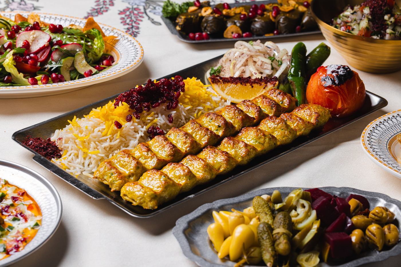 Chicken koobideh skewers with saffron rice and grilled tomato