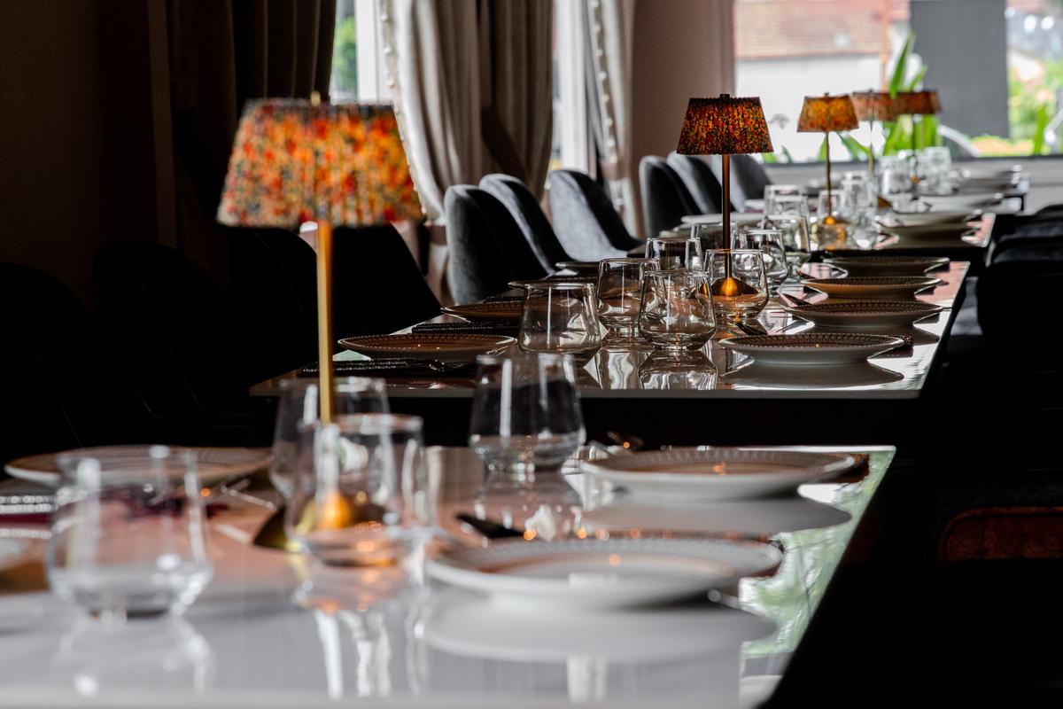 Beaded lamps down the length of the dining table