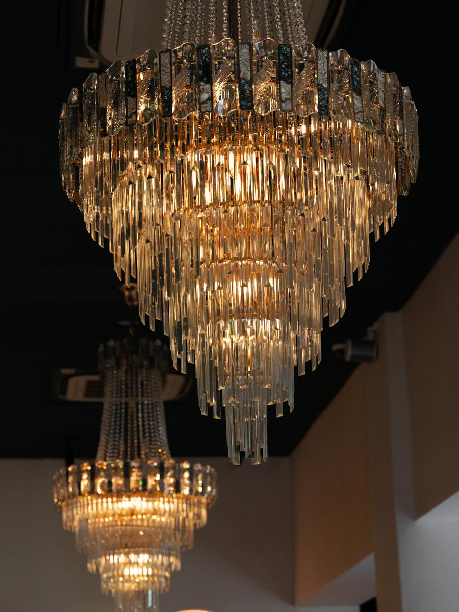 A crystal chandelier, tiered like a wedding cake