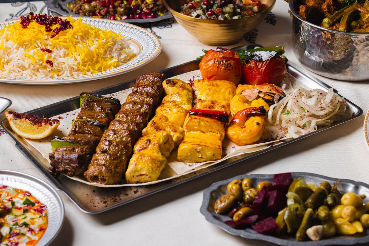 The mixed grill platter: koobideh, jujeh and grilled tomato